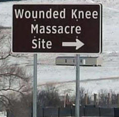 Roadsign points to the Wounded Knee Massacre Site